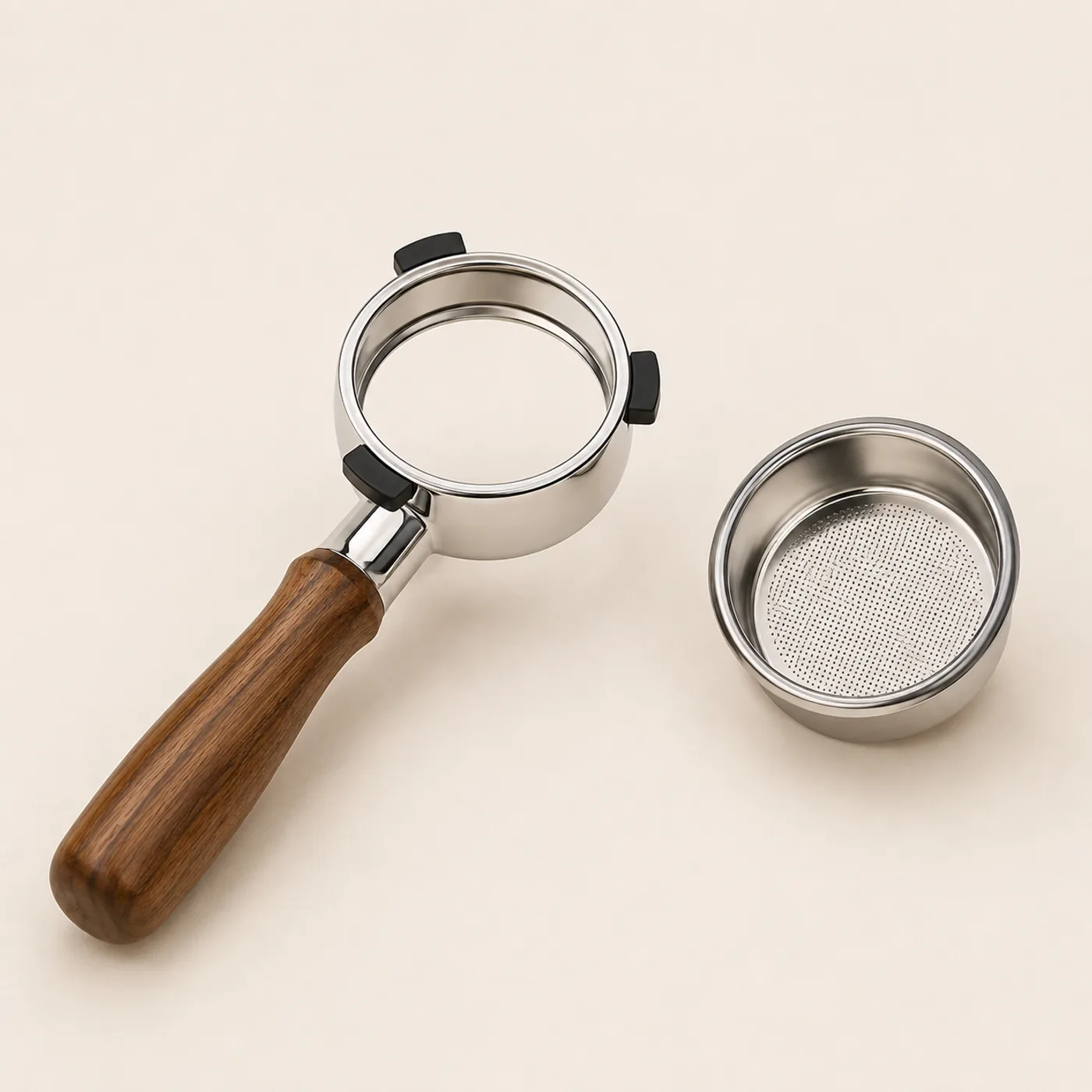 Puckwell bottomless portafilter beside its 2-cup non-pressurized filter basket, three-quarter view